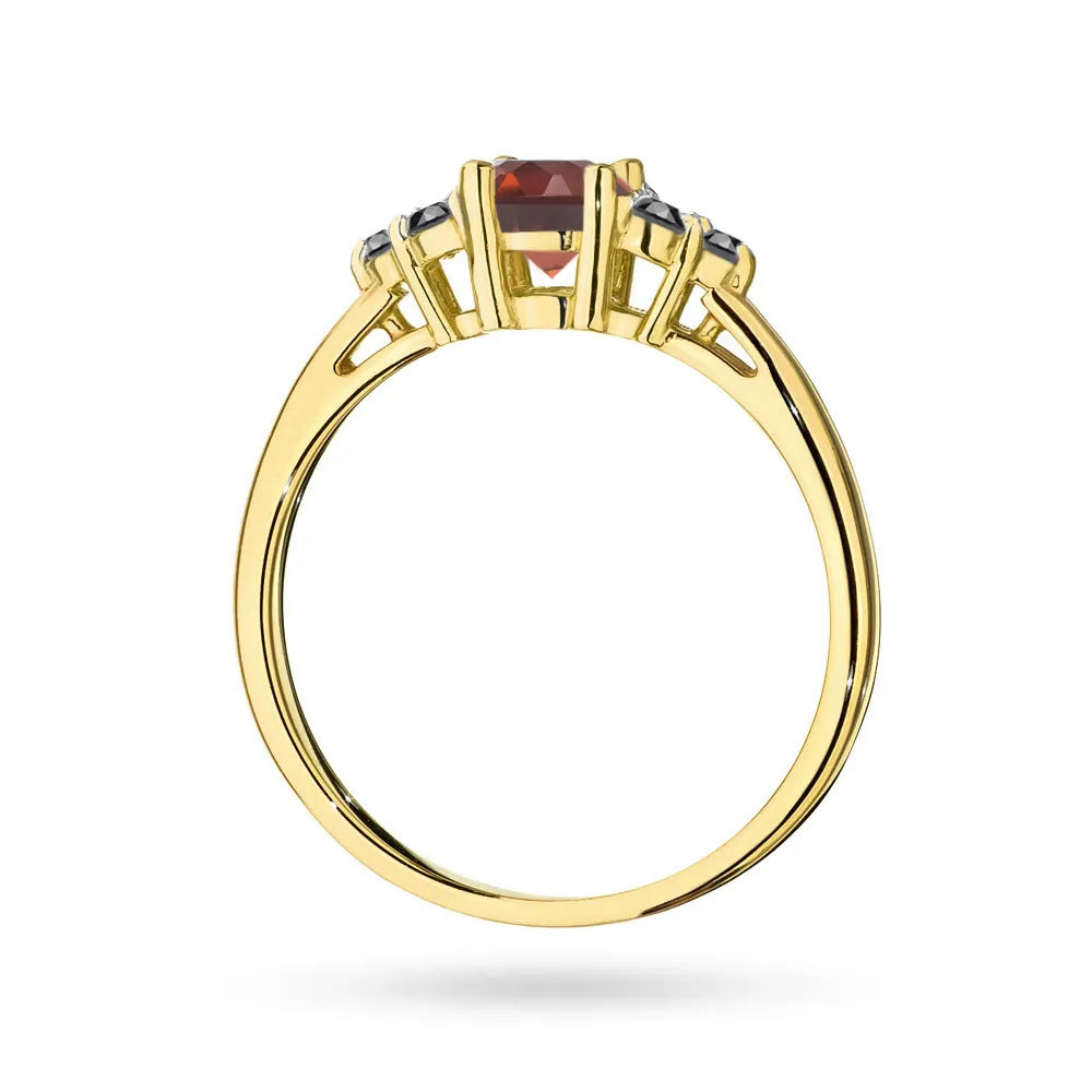 Ring aus 14-karätigem (585) Gold mit 0,60 ct Granat und 6 schwarzen Diamanten. Perfekt als Geschenk.