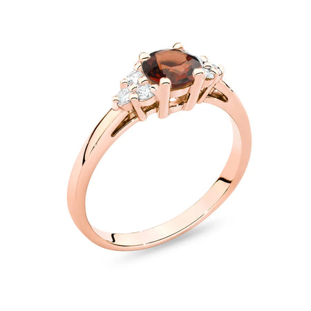 Ring aus 14 Karat (585) Roségold mit 0,60 ct Granat und 6 Diamanten. Perfekt als Geschenk.