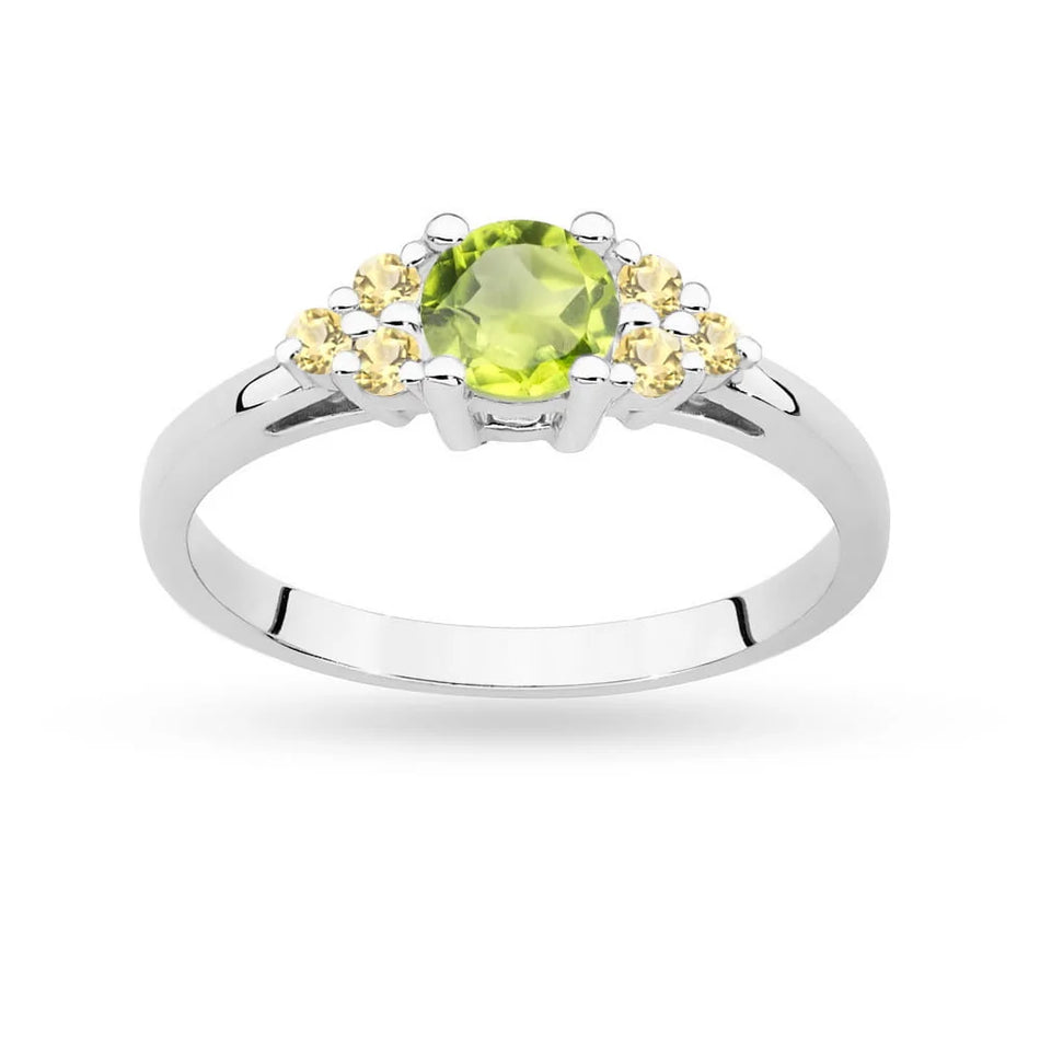 White Gold 14k(585) ring with 0,60ct olivine with 6 bronze diamonds. Perfect for a gift.