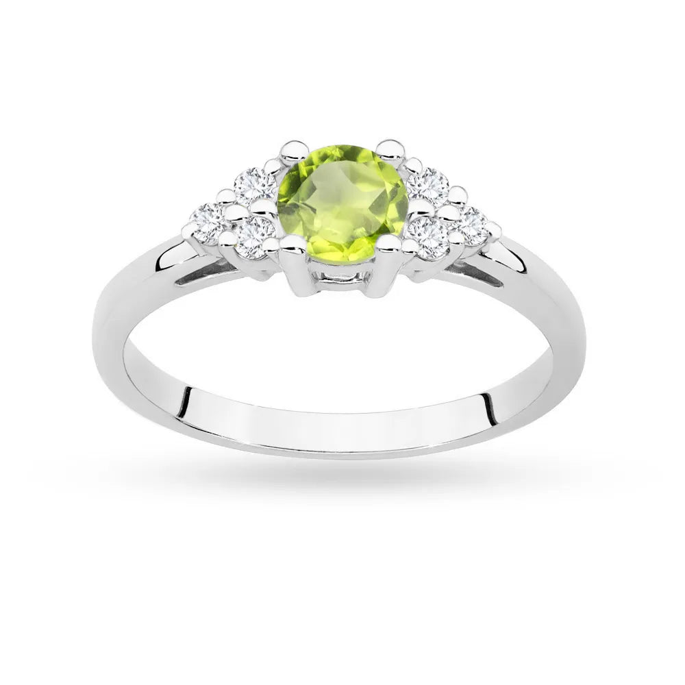 Ring aus 14-karätigem (585) Weißgold mit 0,60 ct Olivin und 6 Diamanten. Perfekt als Geschenk.
