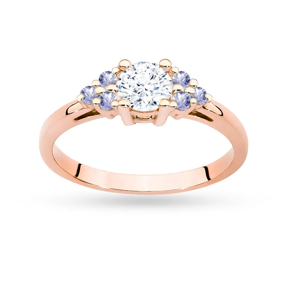 Ring aus 14-karätigem (585) Roségold mit 0,60 ct weißem Saphir und 6 Tansaniten. Wird in einer eleganten Schachtel geliefert, die sich perfekt als Geschenk eignet.