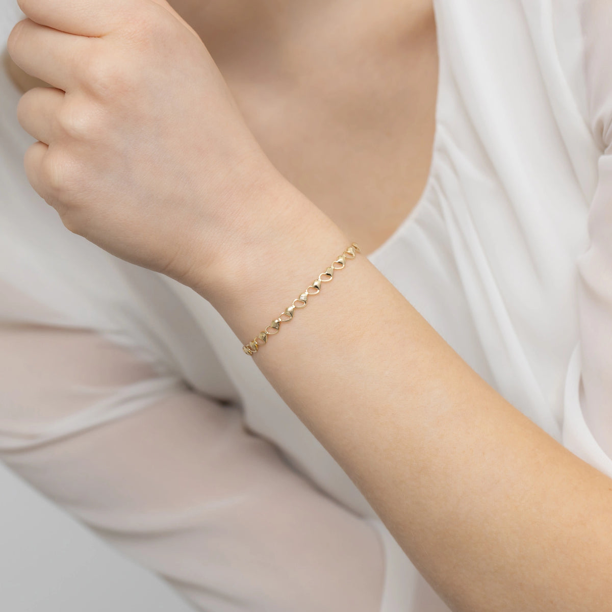 goldsegmentiertes-armband-mit-herzen-b-gw-387-585