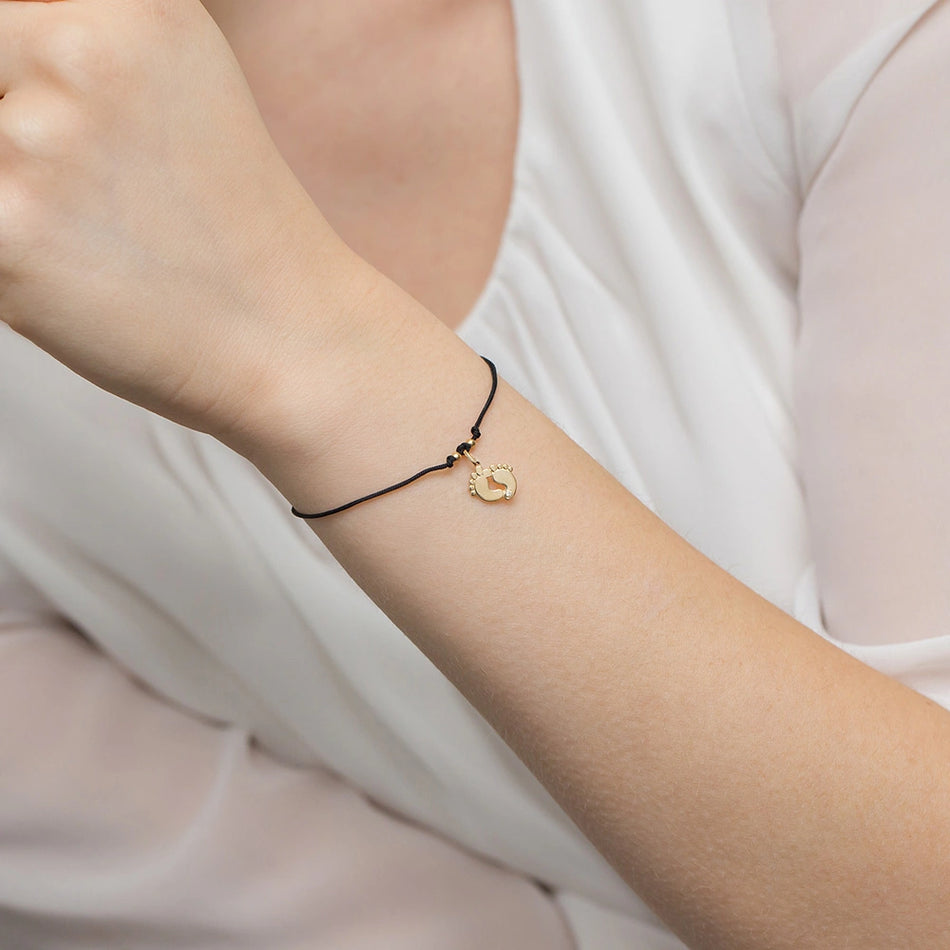 Goldarmband mit Diamant und schwarzem Kordelverschluss