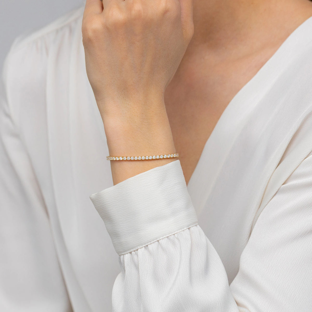 GREMARI 14K yellow gold tennis bracelet with 3.72ct round lab-grown diamonds – four-prong setting detail