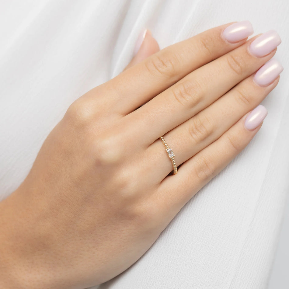 Gold bead ring with white zirconia