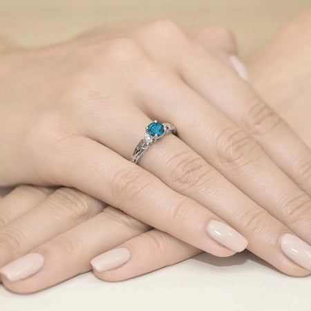 gold-ring-with-0-50ct-topaz-london-blue-and-0-02ct-diamonds-w0014-tol-01