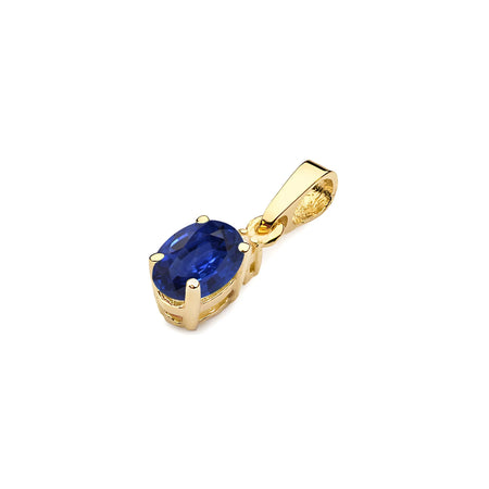 Gold pendant with oval sapphire and additional diamonds.