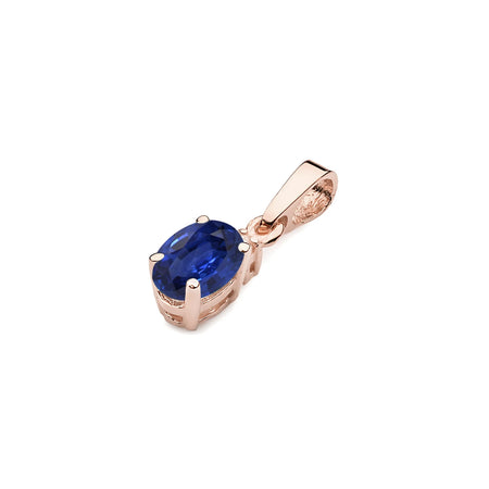 Rose Gold pendant with oval sapphire and additional diamonds.