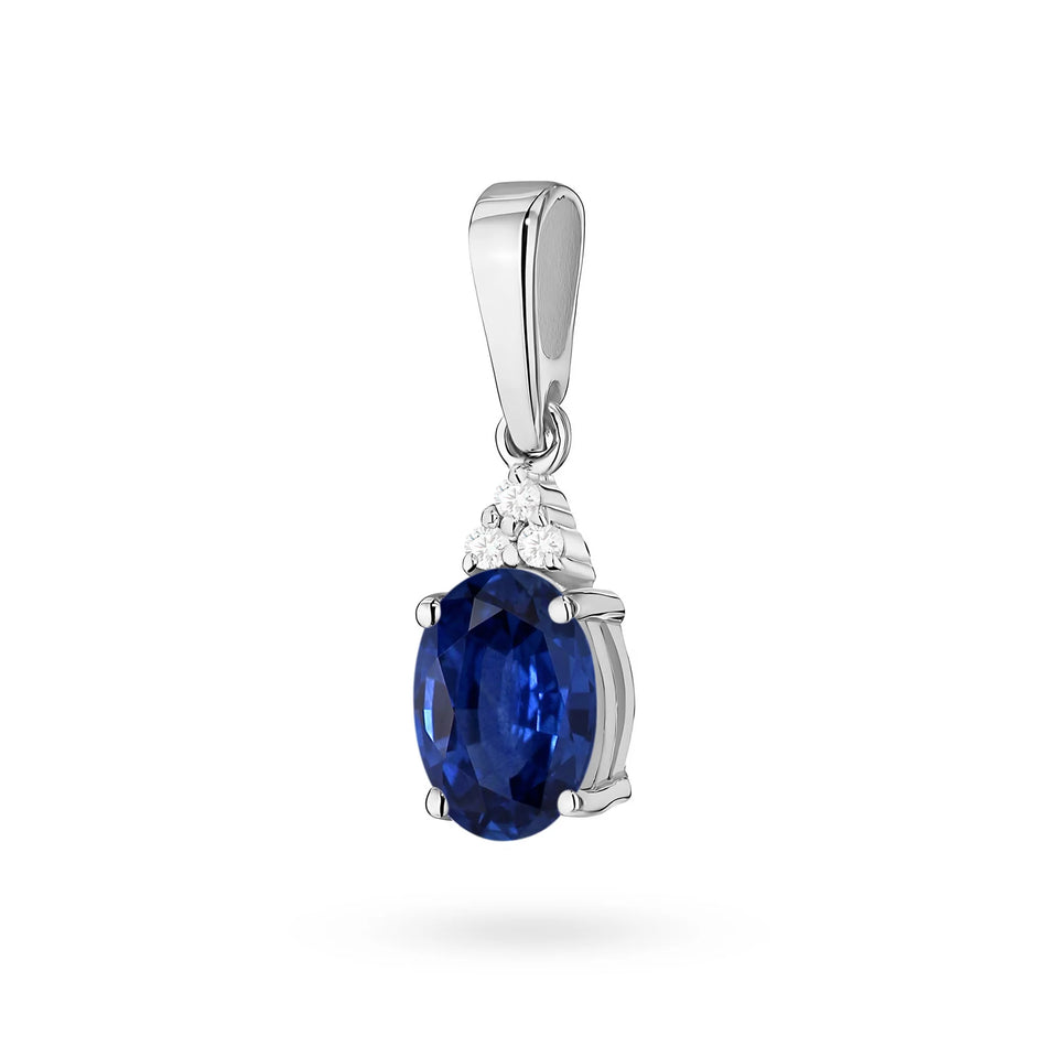 Pendant made of the 14K (585) gold. Our offer includes chains, pendants, necklaces. Central oval cut sapphire 0.90ct and 3 diamonds 0.026ct. Perfect unique gift